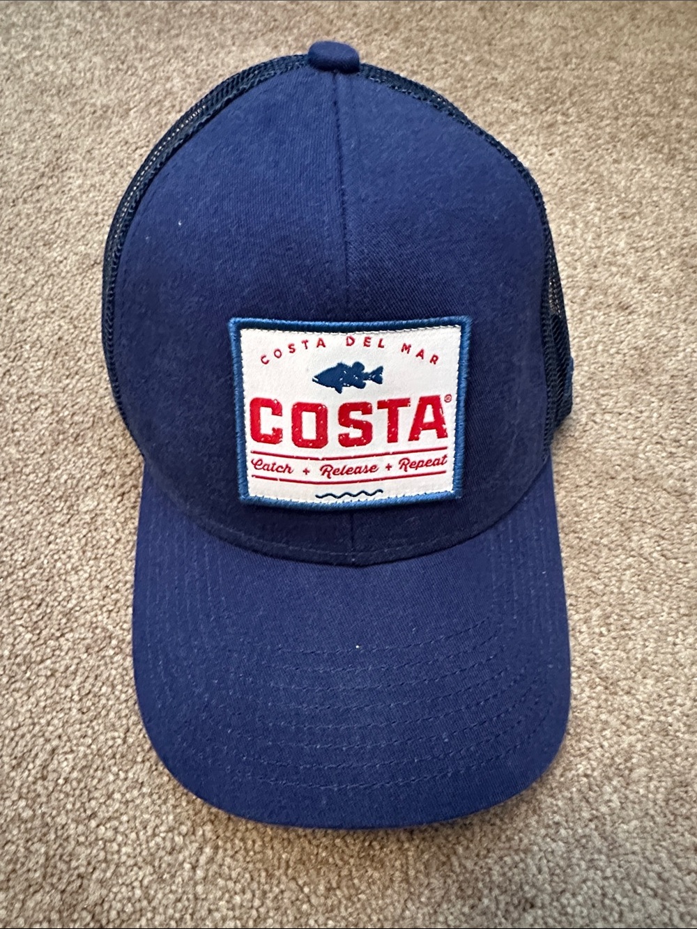 Costa Navy Blue Patch Trucker Hat with Red Logo